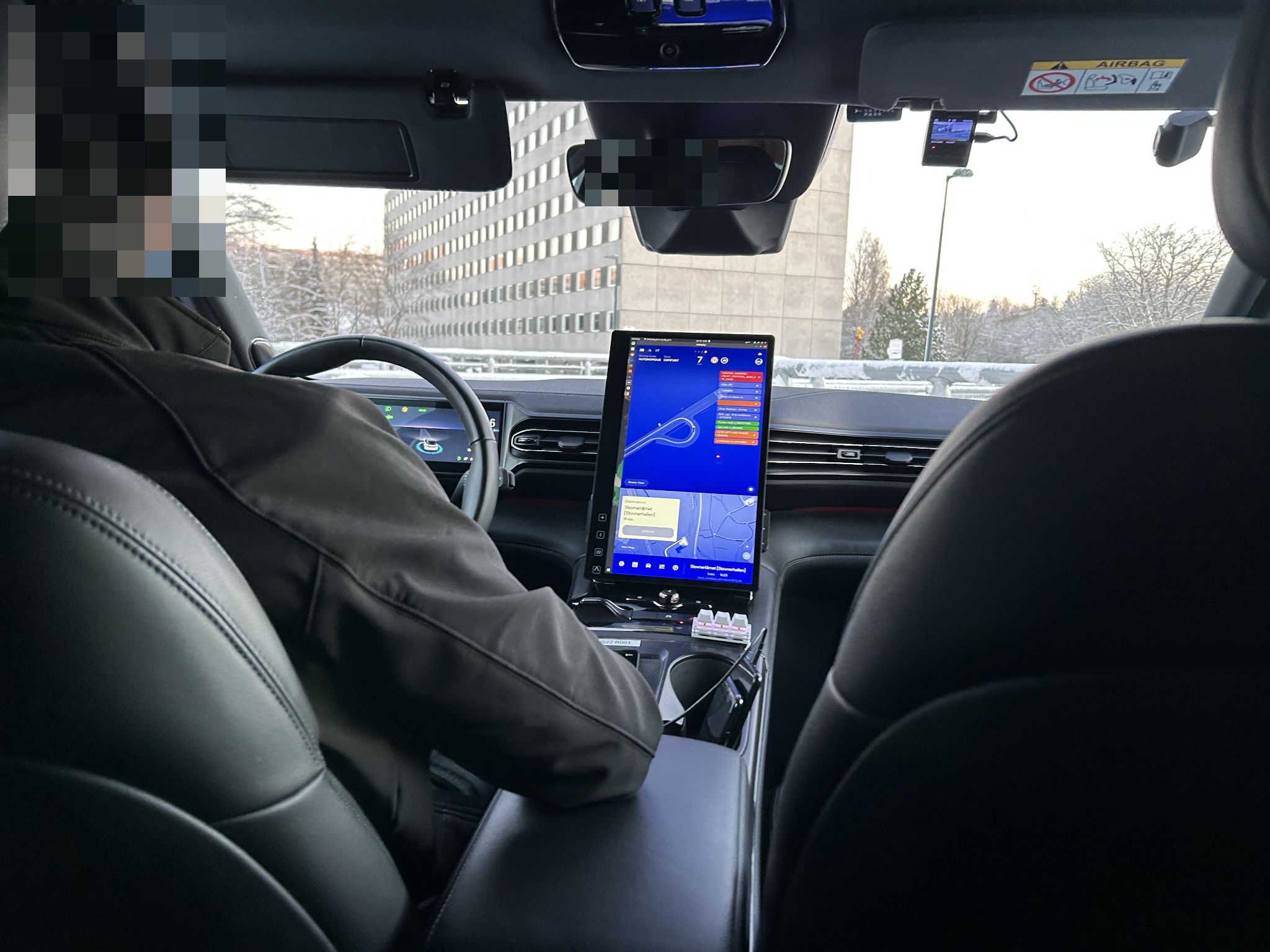 image of the operator inside the car with its instuments.